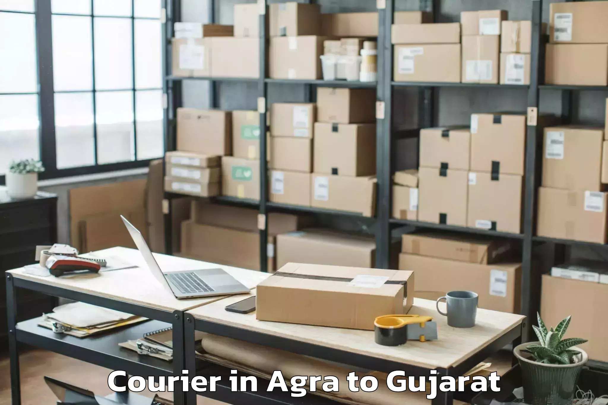 Hassle-Free Agra to Kamdhenu University Gandhinaga Courier